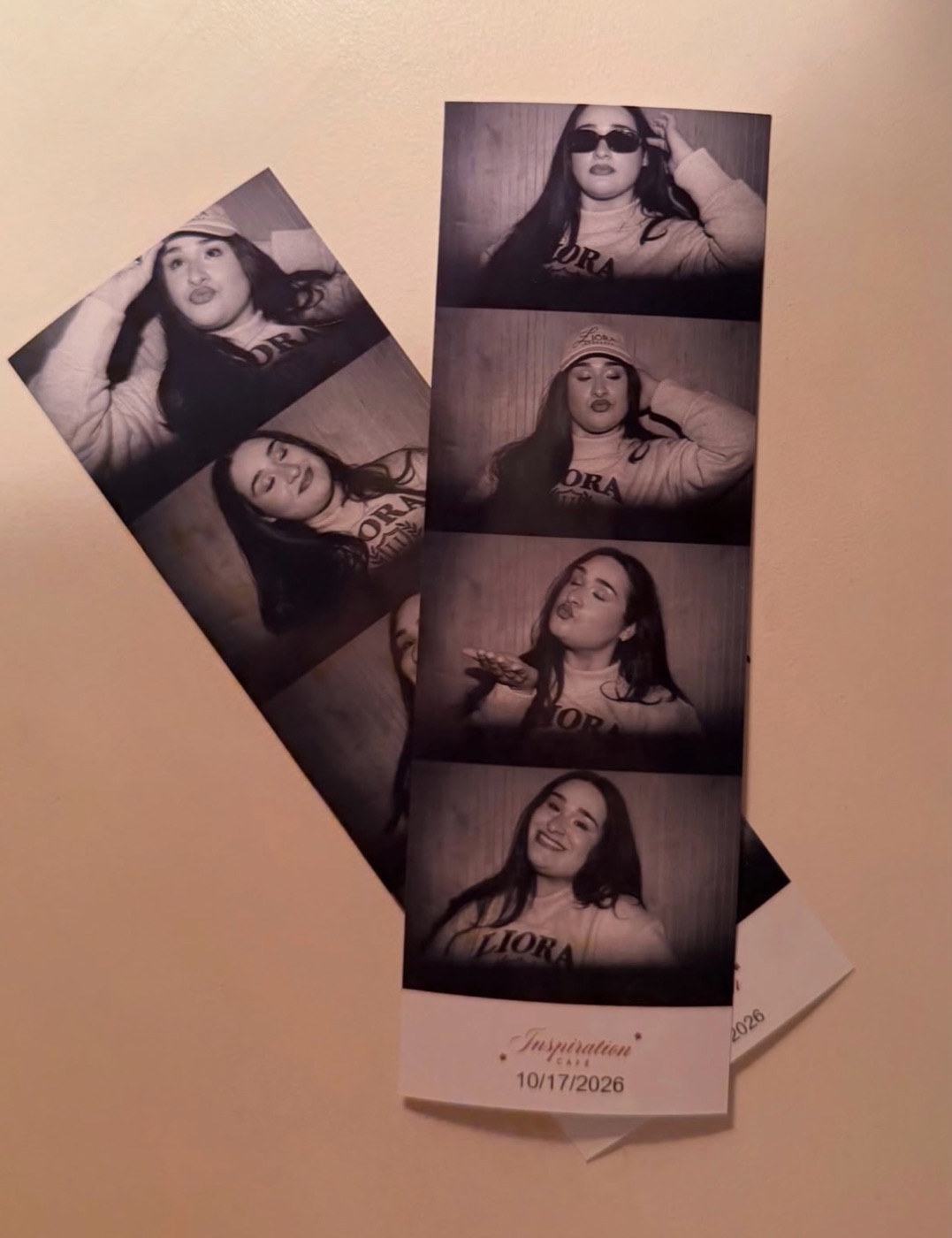 A black-and-white photobooth strip